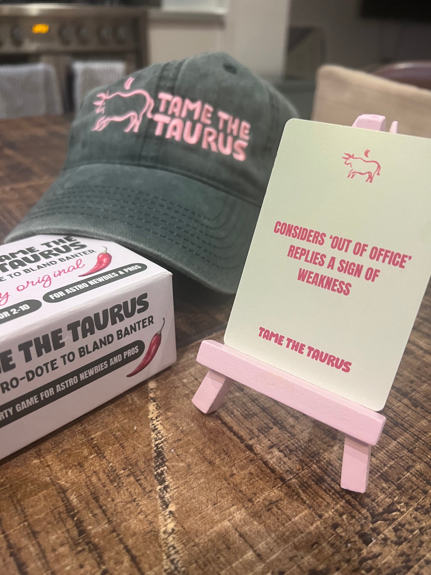 an image that shows astrology game, Tame the Taurus, a party game that's perfect for hens, dinners, drinks, get-togethers and is a perfect gift for any girlie. A lot of fun, simple to play, quick to pick up, even better with a drink.
