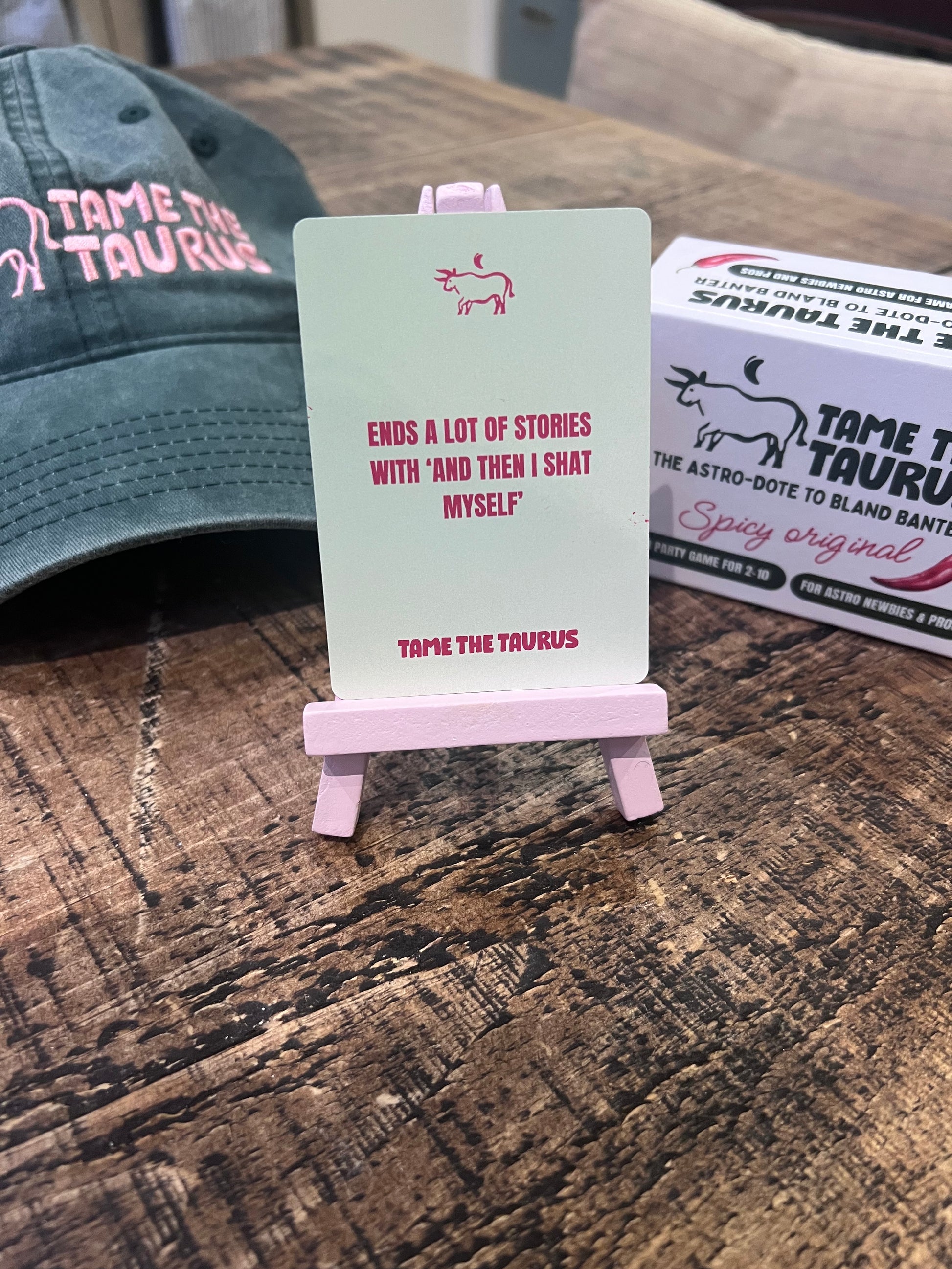 an image that shows astrology game, Tame the Taurus, a party game that's perfect for hens, dinners, drinks, get-togethers and is a perfect gift for any girlie. A lot of fun, simple to play, quick to pick up, even better with a drink.