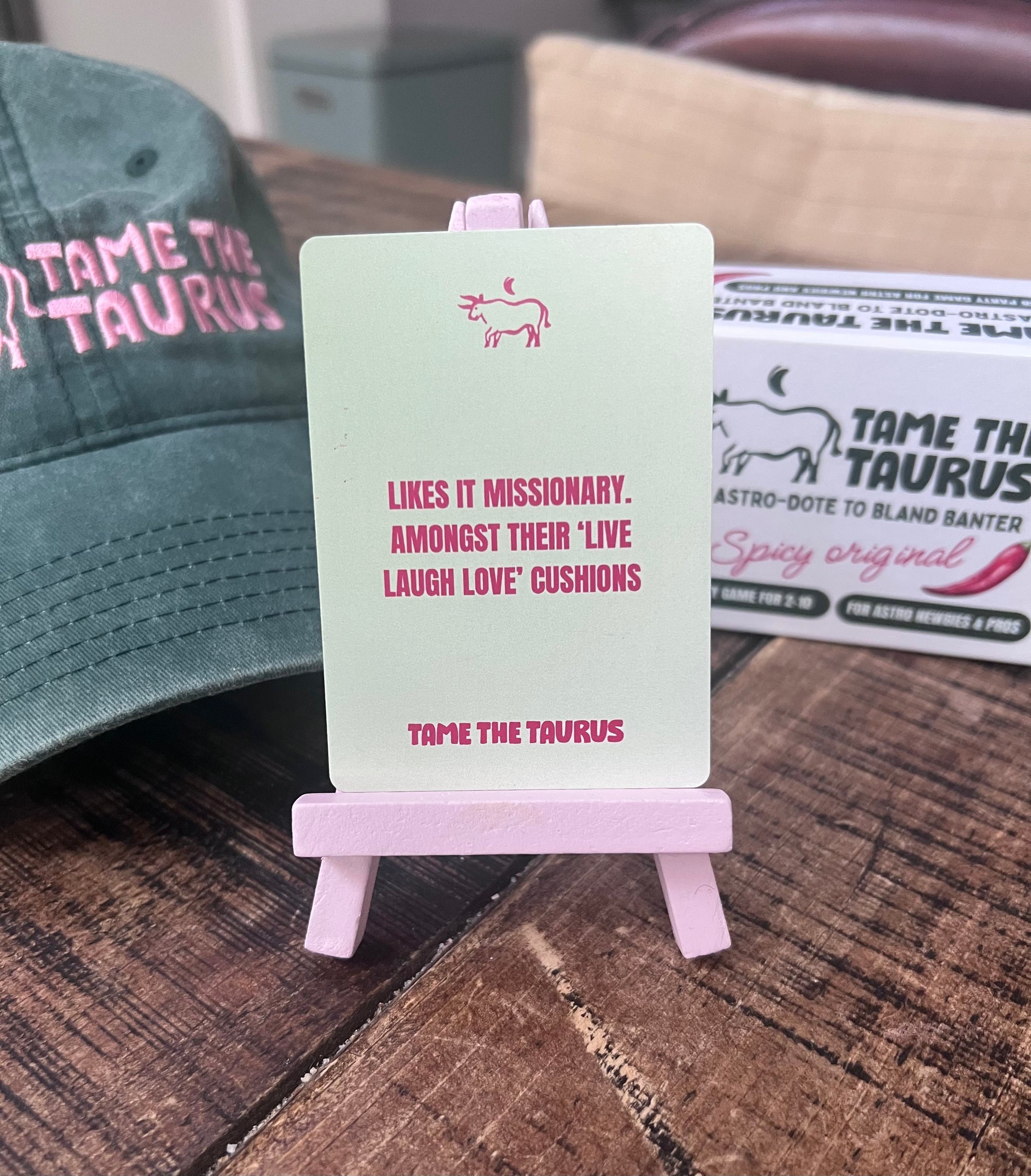 an image that shows astrology game, Tame the Taurus, a party game that's perfect for hens, dinners, drinks, get-togethers and is a perfect gift for any girlie. A lot of fun, simple to play, quick to pick up, even better with a drink.